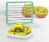 A kiwi slicer and sliced kiwis on a white surface. Produktbild-Vorschau