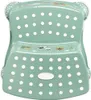 A two-step stool for children, featuring a green color and polka dot pattern. Produktbild-Vorschau
