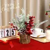 A festive Christmas decoration with a mini tree in a log holder, a perpetual calendar showing December 25th, and a cup of tea. Produktbild-Vorschau