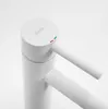 A close-up studio shot of a white faucet. Náhled obrázku produktu
