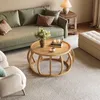 A living room scene with a couch, coffee table, and armchair. Anteprima dell’immagine prodotto