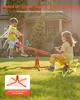 Two children are playing on an orange seesaw in a grassy backyard with a house in the background. Náhľad obrázku produktu