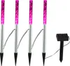 Four pink solar garden lights and a solar panel are arranged on a white background. Produktbild-Vorschau