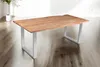 A wooden dining table with metal legs is shown in a bright, minimalist room with a plant in the background. Produktbild-Vorschau