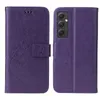 A purple flip phone case with a floral and butterfly embossed design is shown open and closed. Produktbild-Vorschau