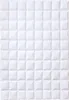 A white quilted comforter laid flat. Náhled obrázku produktu
