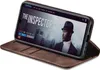 A smartphone in a brown flip case is displayed on a white background, showing a movie interface on the screen. Produktbild-Vorschau