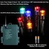A close-up of battery-powered LED string lights with a control box and batteries. Produktbild-Vorschau