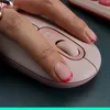 A close-up shot of a hand using a pink computer mouse. Náhľad obrázku produktu