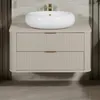 A modern bathroom vanity with a vessel sink and gold faucet. Anteprima dell’immagine prodotto