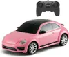 A pink remote-controlled Volkswagen Beetle car with a black roof and a black remote control. Náhled obrázku produktu
