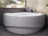 A modern corner bathtub in a bathroom setting. Produktbild-Vorschau