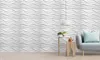 A living room scene with a couch, side table, and a lamp, showcasing the 3D wall panels. Anteprima dell’immagine prodotto