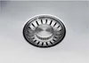 A close-up view of a stainless steel sink drain with a basket strainer. Produktbild-Vorschau