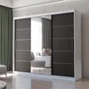 A modern sliding door wardrobe with a mirrored section, set in a well-lit room with curtains and a sofa visible in the reflection. Produktbild-Vorschau