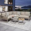 An outdoor patio setting at dusk with a sectional sofa, coffee tables, and a scenic view of a lake and mountains. Produktbild-Vorschau