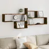 A wooden wall shelf with various decorative items and books. Anteprima dell’immagine prodotto