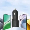 A car charger is shown in the center, surrounded by smartphones, with a sky background. Anteprima dell’immagine prodotto