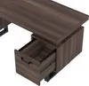 A close-up view of a brown wooden desk with an open drawer. Podgląd zdjęcia produktu