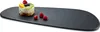 A dessert on a black serving platter. Anteprima dell’immagine prodotto