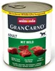 A can of dog food with raw meat pieces shown in front of it. Náhľad obrázku produktu
