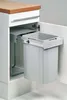 A pull-out trash can system installed in a kitchen cabinet. Voir les images du produit