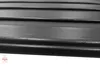 A close-up view of black textured panels, likely wall or ceiling panels, with a subtle wood grain effect. A small logo is visible in the bottom left corner. Náhled obrázku produktu