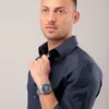 A man wearing a dark blue shirt and a silver watch. Anteprima dell’immagine prodotto