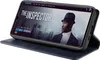 A smartphone in a blue flip case is displayed, showing a movie poster on its screen. Produktbild-Vorschau