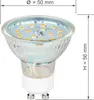 A close-up studio shot of an LED light bulb with dimensions indicated. Produktbild-Vorschau