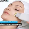 A close-up shot of a woman's face receiving a skincare treatment from a device. Produktbild-Vorschau