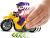 A hand is pushing a yellow LEGO motorcycle with a rider wearing a purple helmet and pink shirt. Podgląd zdjęcia produktu