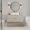 A modern bathroom vanity with a sink, mirror, and toilet. Anteprima dell’immagine prodotto