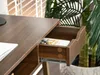 A close-up shot of a brown wooden desk with an open drawer. Voir les images du produit