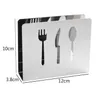A silver napkin holder with cutouts of a fork, knife, and spoon, with dimensions indicated by text. Produktbild-Vorschau