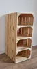 A wooden shoe rack made of crates, standing on a wooden floor against a white wall. Produktbild-Vorschau
