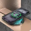 A smartphone in a protective case is placed on a wireless charger, indicating it is charging. Produktbild-Vorschau