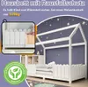 A white house-shaped bed with a picket fence railing, set against a purple wall with star decorations. Produktbild-Vorschau