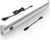 A white LED under-cabinet light with a power cord and an extension cord on a white background. Náhľad obrázku produktu