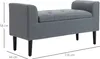 A grey upholstered storage bench with black wooden legs is shown from a side angle with dimensions indicated. Podgląd zdjęcia produktu