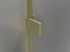 A close-up view of a brushed gold shower door hinge against a gray wall. Produktbild-Vorschau