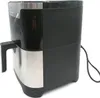 A black and silver air fryer is shown against a white background. Voir les images du produit