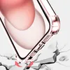 A close-up of a transparent phone case with a pink tint, showing its protective features against a cracked surface. Produktbild-Vorschau