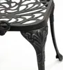 A close-up view of the ornate leg and seat edge of a dark gray metal garden chair or table. Produktbild-Vorschau