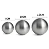 Three stainless steel spheres of different sizes are displayed side-by-side, with measurements indicated above each. Podgląd zdjęcia produktu