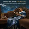 A woman is reading a Harry Potter book while wrapped in a Harry Potter themed blanket on a couch, with a snowy Hogwarts castle visible outside the window. Produktbild-Vorschau