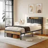 A bedroom scene with a bed, nightstands, and artwork. Voir les images du produit