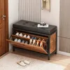 A shoe cabinet with a bench seat in a hallway, with shoes stored inside and a camera on top. Podgląd zdjęcia produktu
