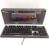 A Roccat Pyro gaming keyboard is shown in its packaging, with the keyboard itself also displayed in front of the box. Produktbild-Vorschau