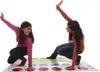 Two young women playing Twister on a mat. Náhled obrázku produktu